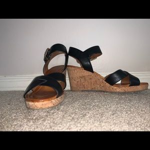 Black leather strap with wedged heel